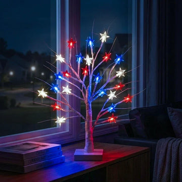 Decoratieve sterrenlamp – boompje met rode, witte en blauwe sterren op tafel