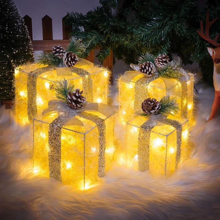 Lichtgevende kerstcadeaus – sierdozen met dennenappels voor onder de kerstboom