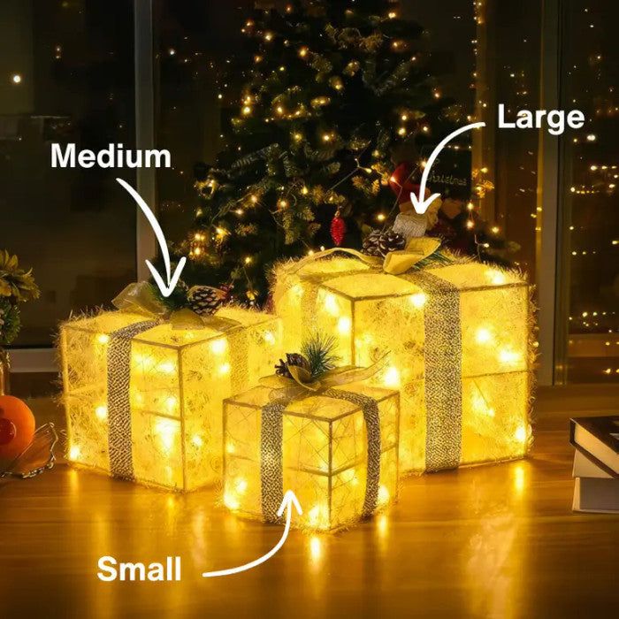 Lichtgevende kerstcadeaus – sierdozen met dennenappels voor onder de kerstboom