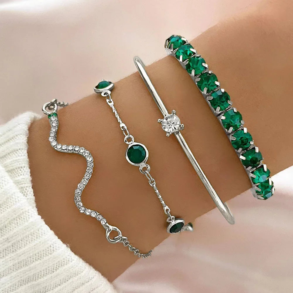 Serpenta Set van 4 slangenarmbanden met groene edelstenen en strasssteentjes