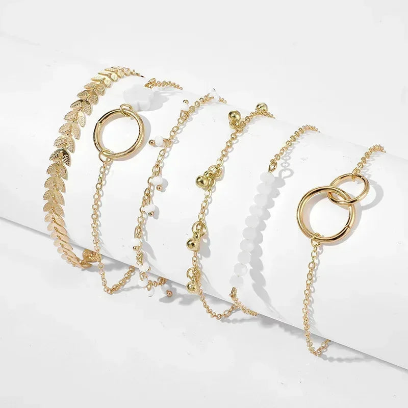Serpenta Set van 4 slangenarmbanden met groene edelstenen en strasssteentjes