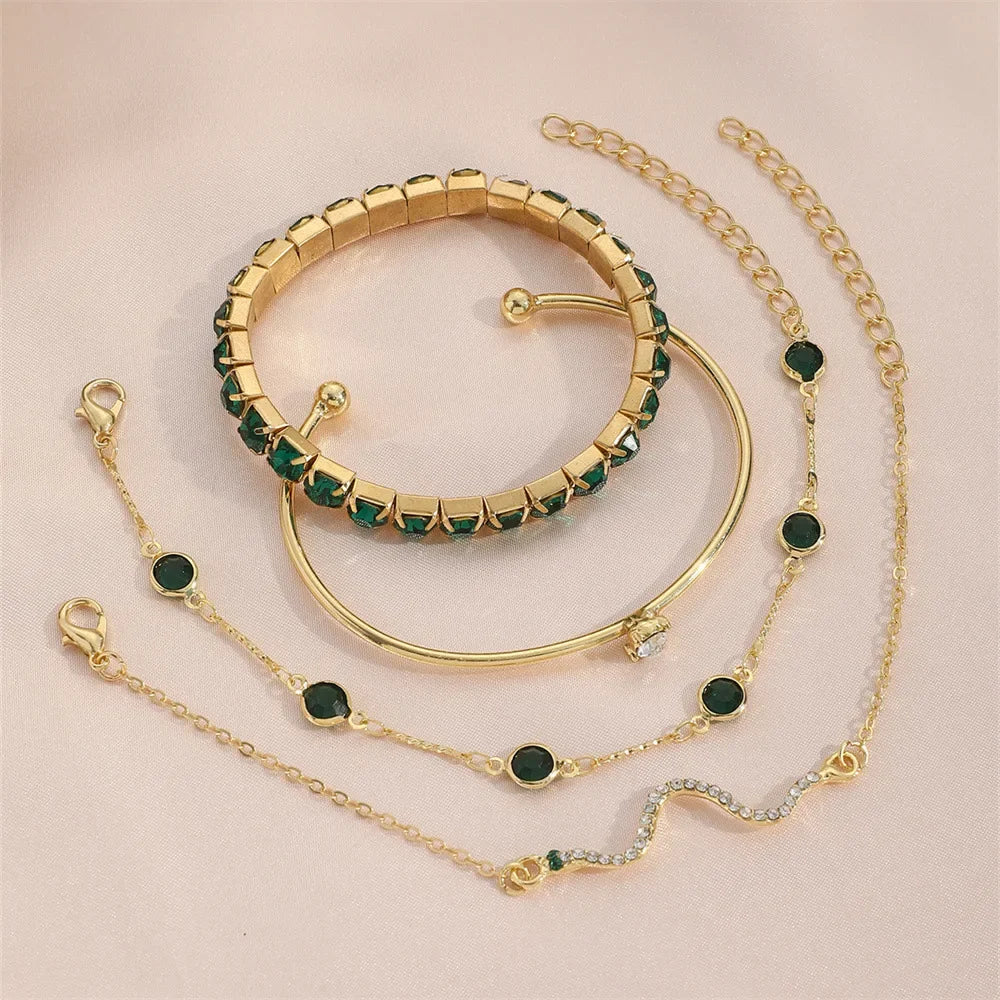 Serpenta Set van 4 slangenarmbanden met groene edelstenen en strasssteentjes