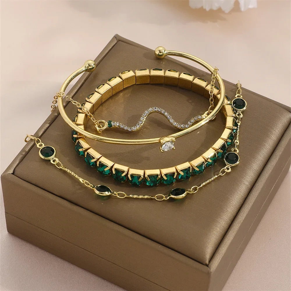 Serpenta Set van 4 slangenarmbanden met groene edelstenen en strasssteentjes