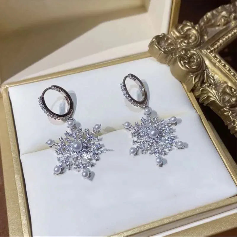 Arctelle Silver earrings for women with snowflake design and shiny cubic zirconia imitation
