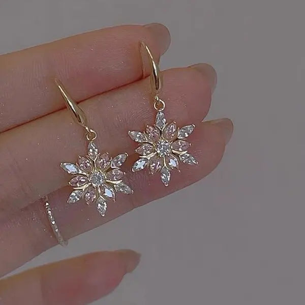Arctelle Silver earrings for women with snowflake design and shiny cubic zirconia imitation