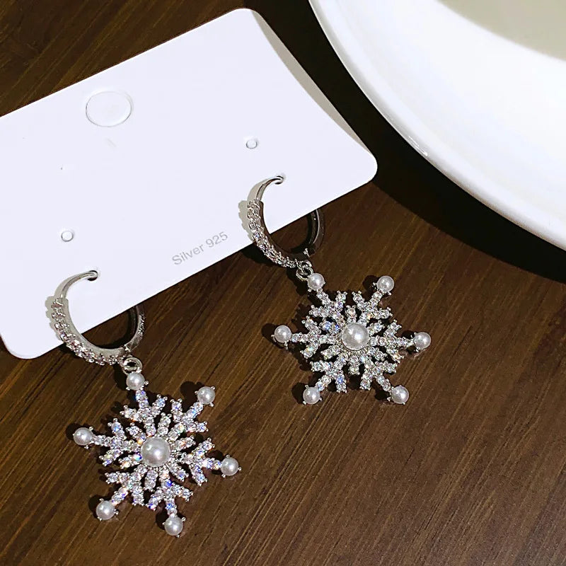 Arctelle Silver earrings for women with snowflake design and shiny cubic zirconia imitation